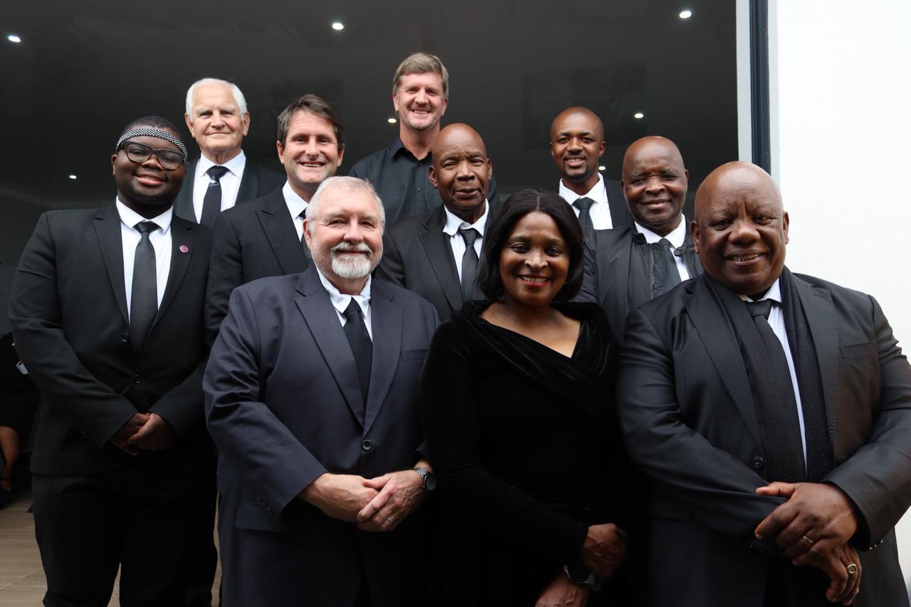 MUCM Board of Governance and leadership team in formal attire