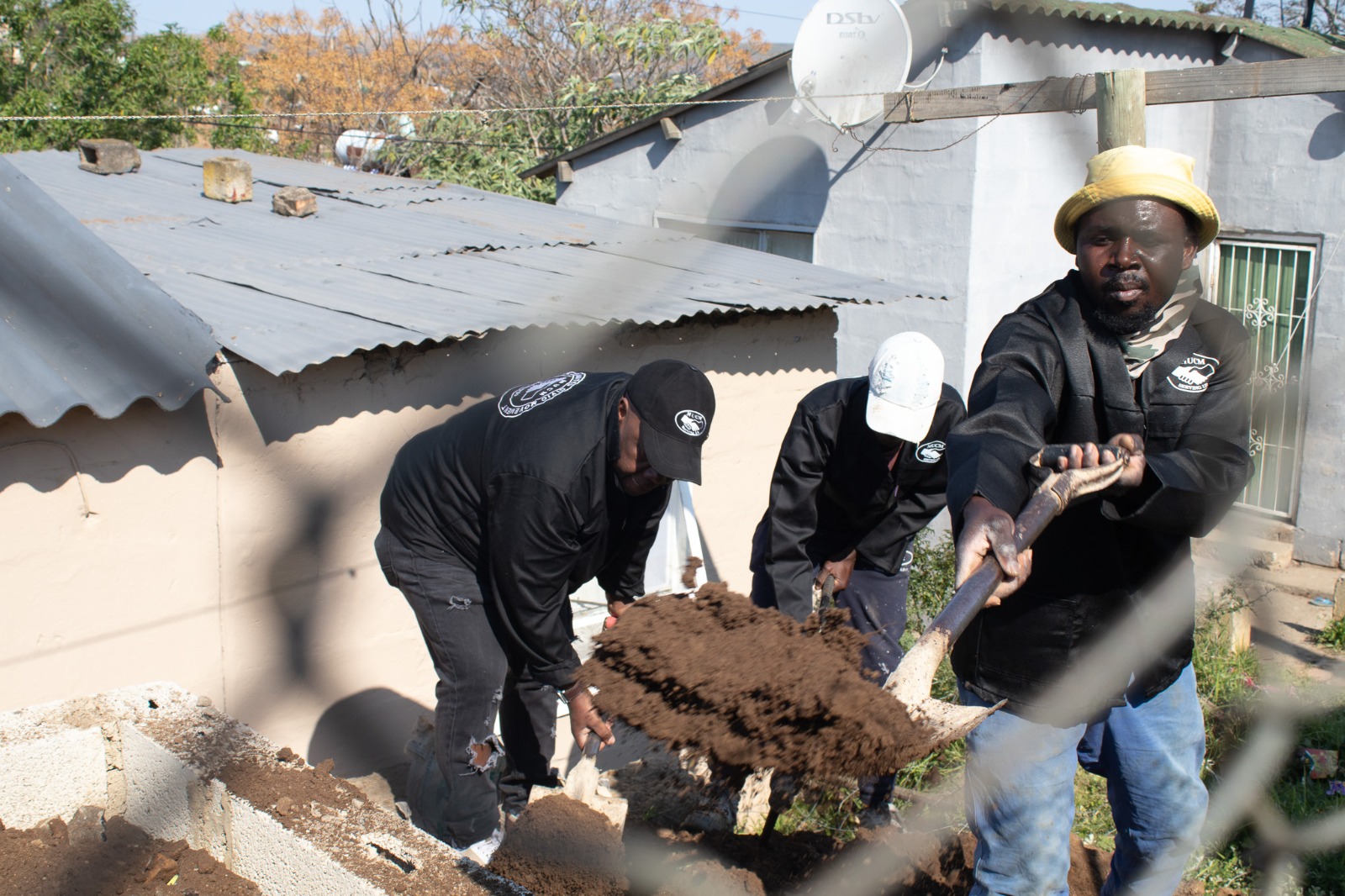 MUCM Chairperson Andile Peter and members of the team prepare the foundation for the water tank