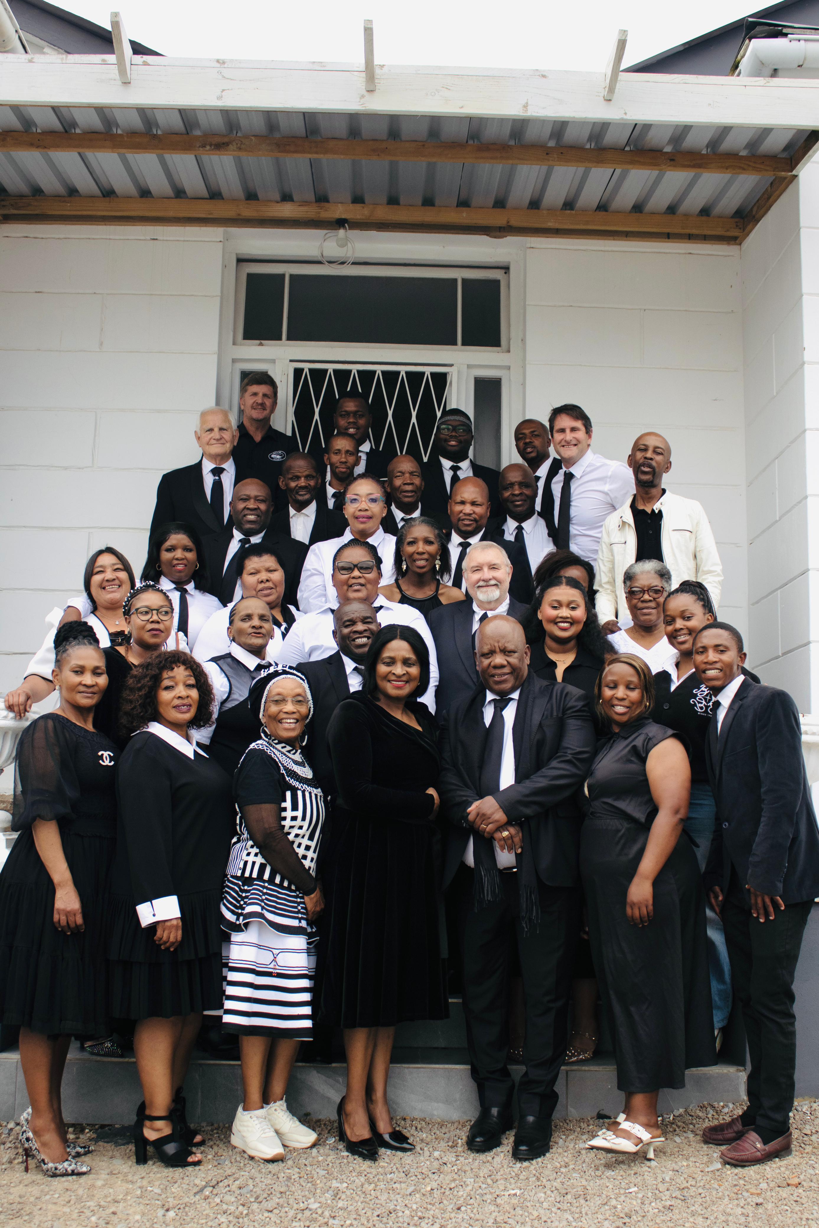MUCM members on the steps of the Makhanda community gathering